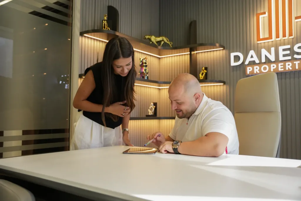 The Danesya team reviewing a deal together